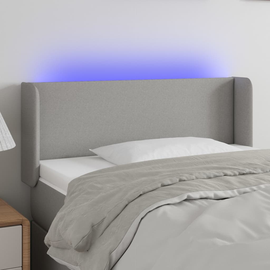 sengegavl med LED-lys 103x16x78/88 cm stof lysegrå