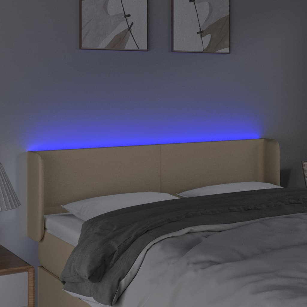 sengegavl med LED-lys 147x16x78/88 cm stof cremefarvet