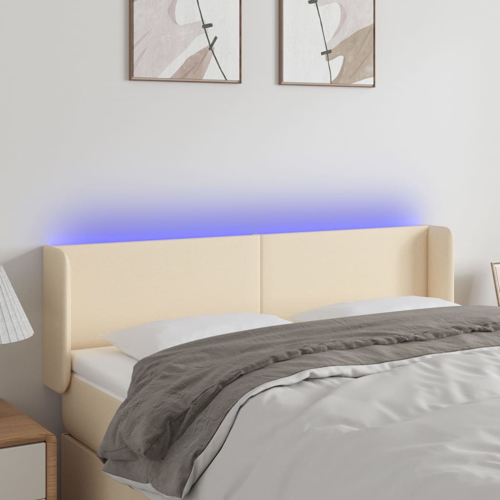 sengegavl med LED-lys 147x16x78/88 cm stof cremefarvet
