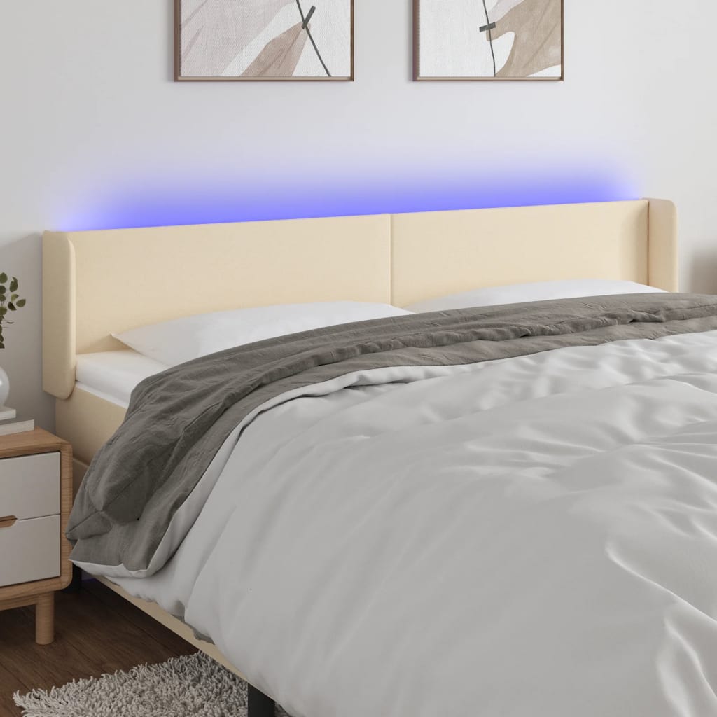 sengegavl med LED-lys 203x16x78/88 cm stof cremefarvet