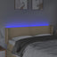 sengegavl med LED-lys 147x16x78/88 cm stof cremefarvet