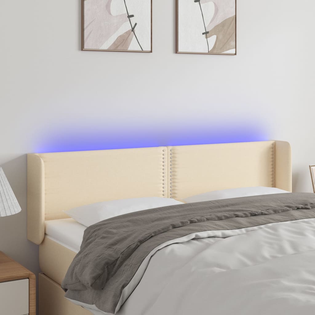 sengegavl med LED-lys 147x16x78/88 cm stof cremefarvet
