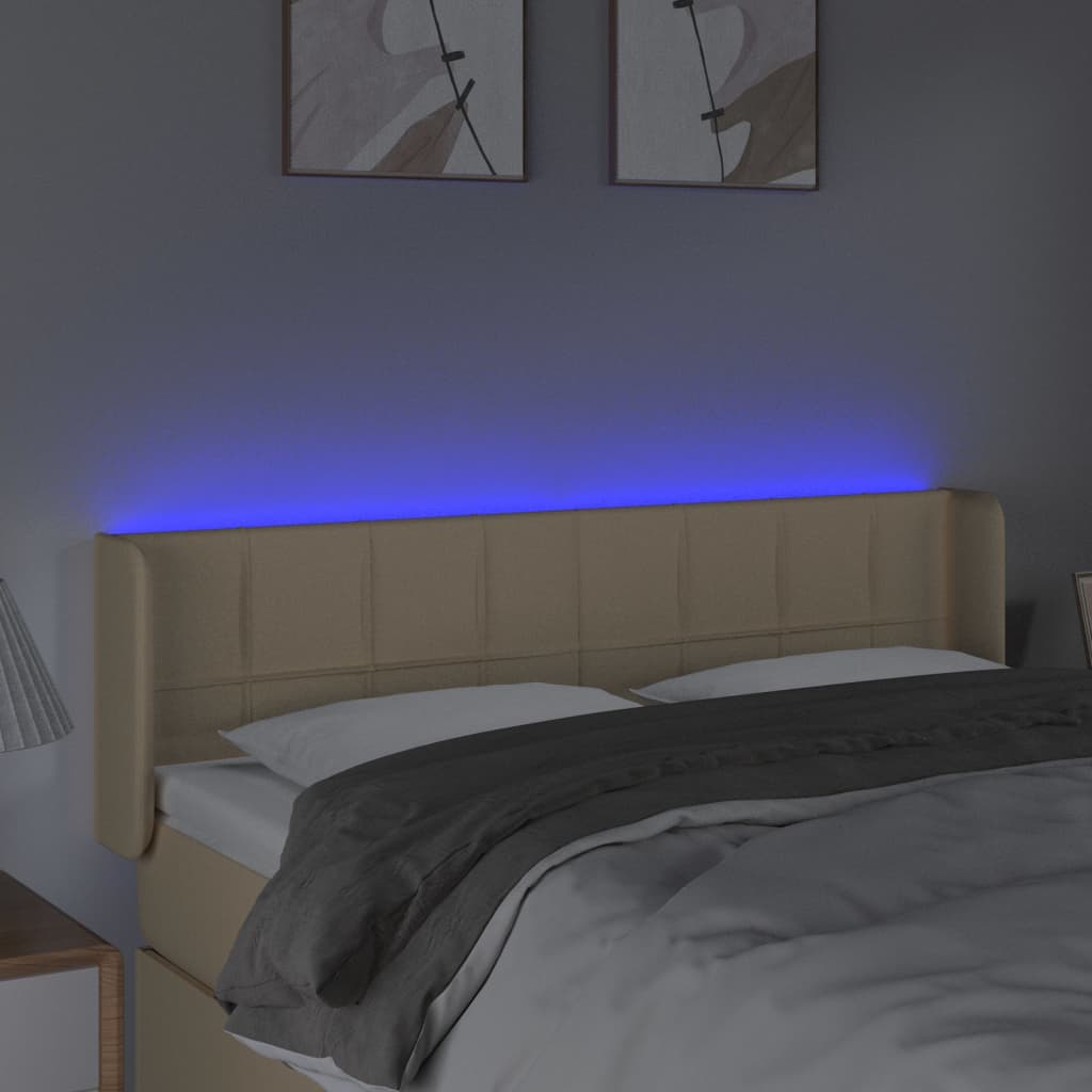 sengegavl med LED-lys 147x16x78/88 cm stof cremefarvet