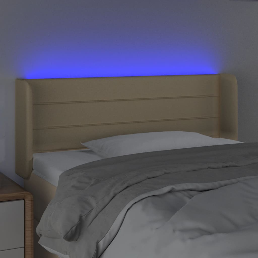 sengegavl med LED-lys 83x16x78/88 cm stof cremefarvet