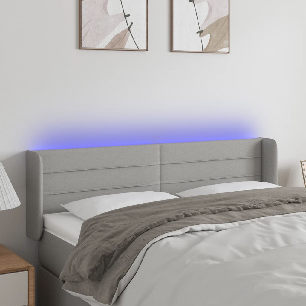 sengegavl med LED-lys 147x16x78/88 cm stof lysegrå