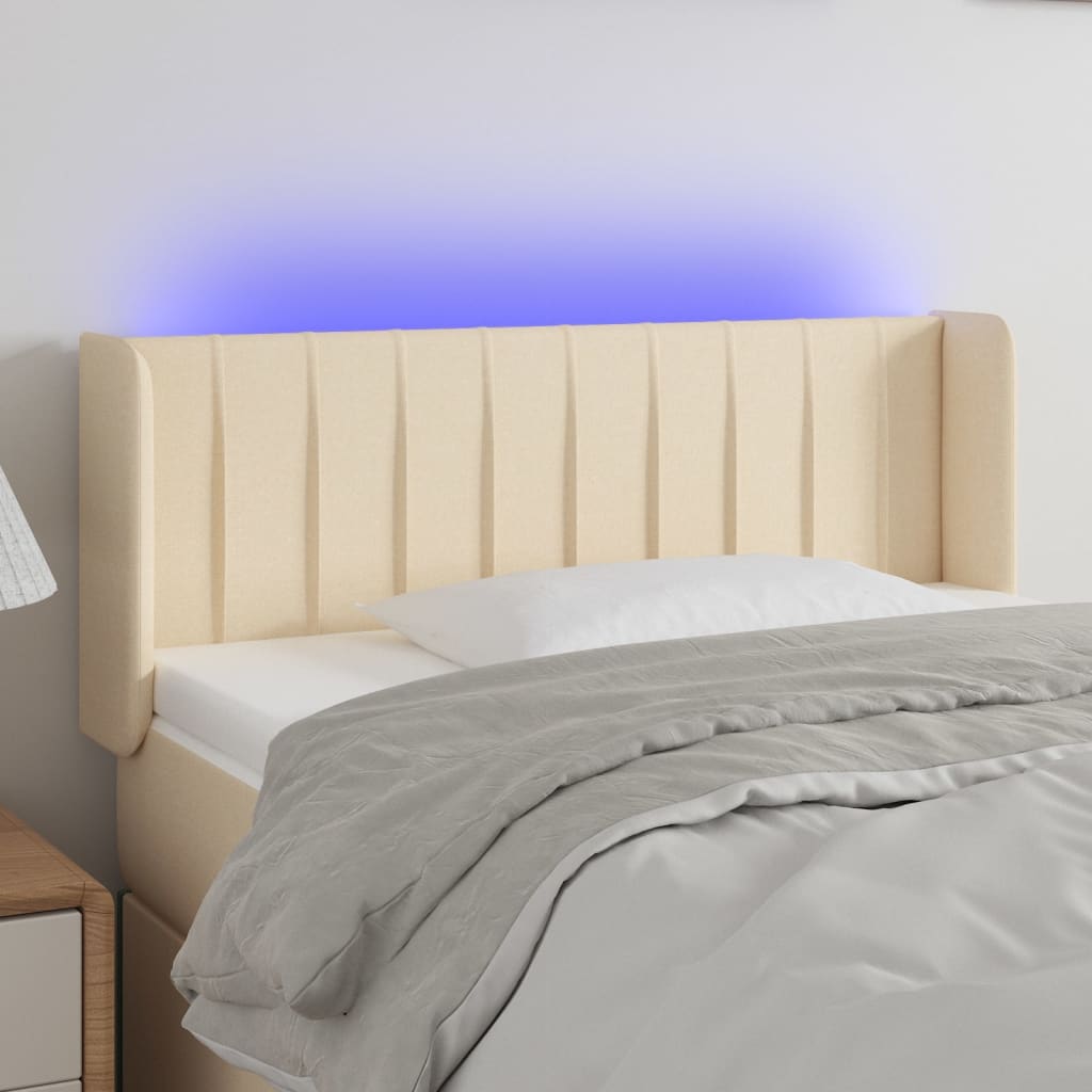 sengegavl med LED-lys 103x16x78/88 cm stof cremefarvet