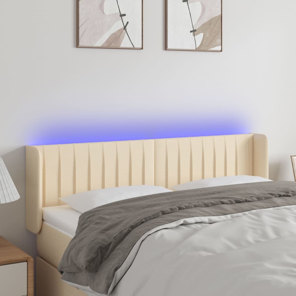 sengegavl med LED-lys 147x16x78/88 cm stof cremefarvet