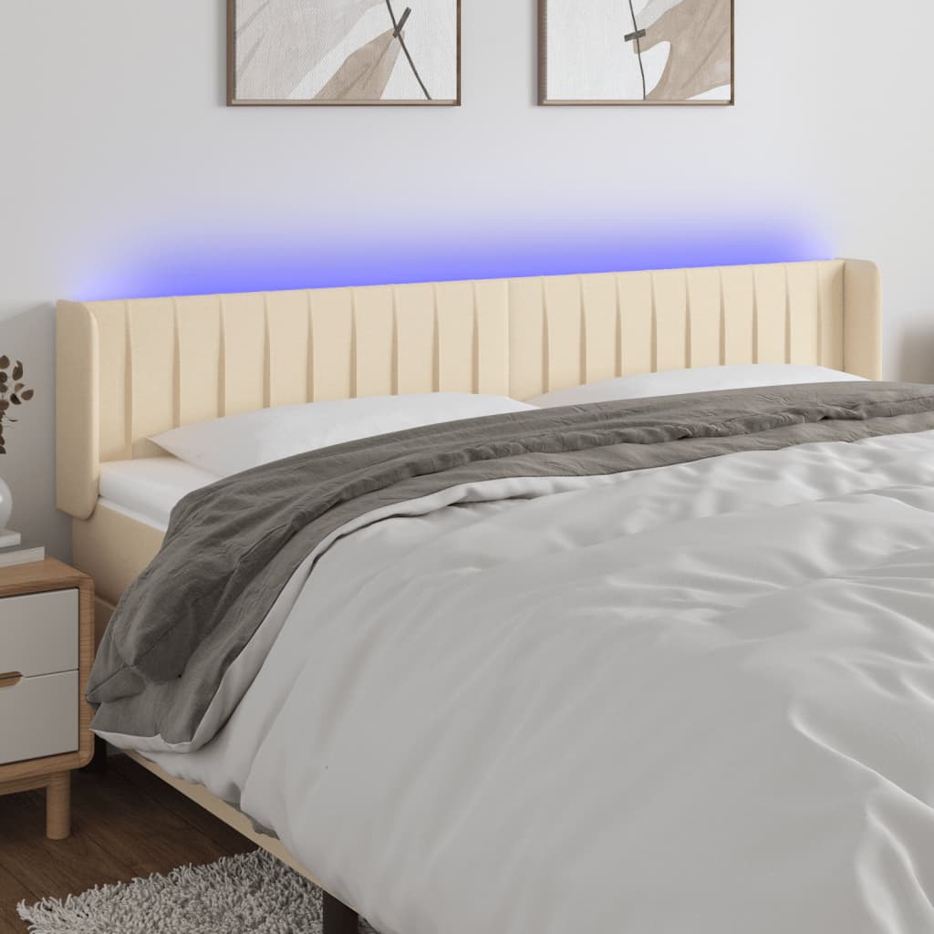 sengegavl med LED-lys 203x16x78/88 cm stof cremefarvet