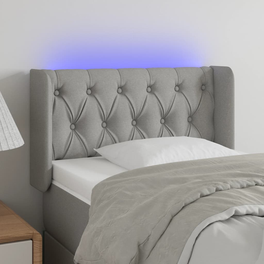 sengegavl med LED-lys 83x16x78/88 cm stof lysegrå