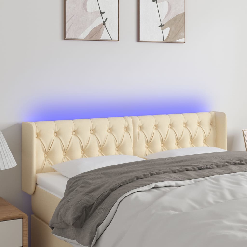 sengegavl med LED-lys 147x16x78/88 cm stof cremefarvet