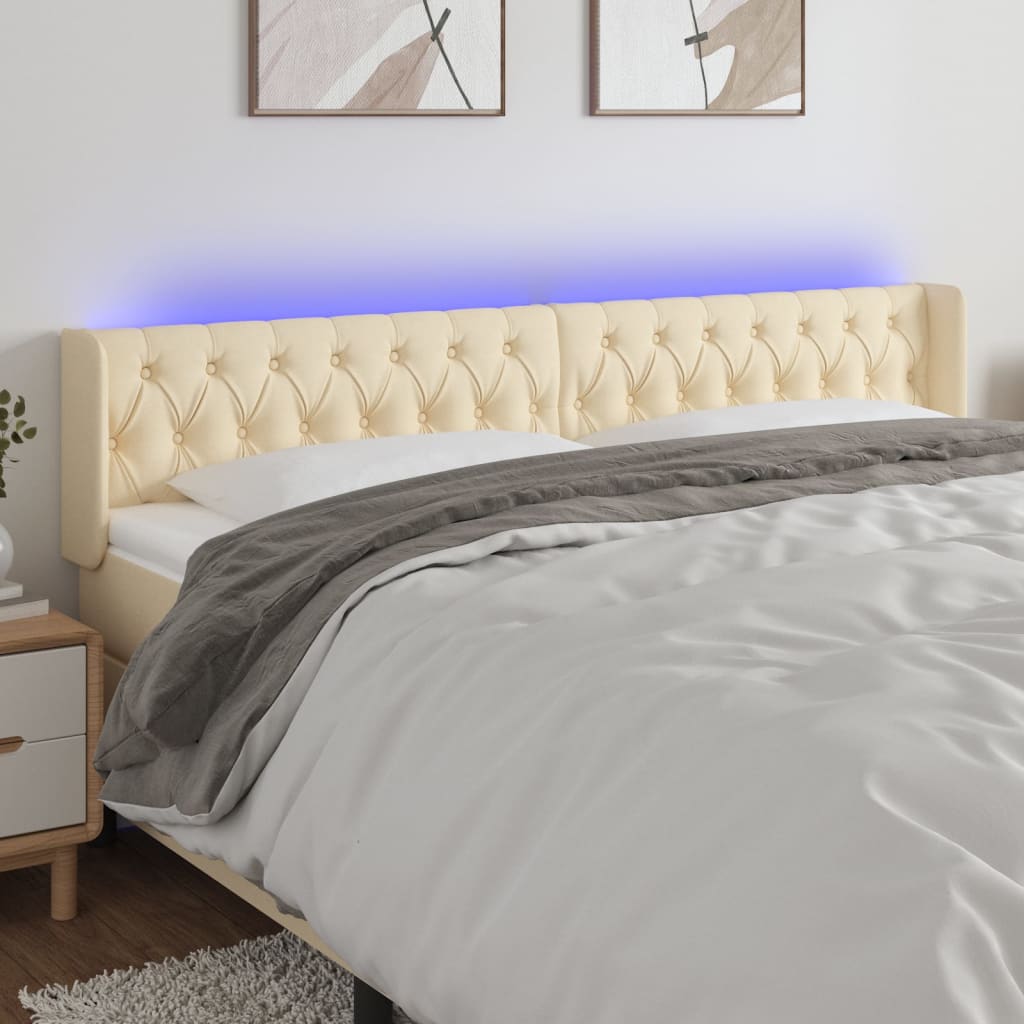 sengegavl med LED-lys 203x16x78/88 cm stof cremefarvet