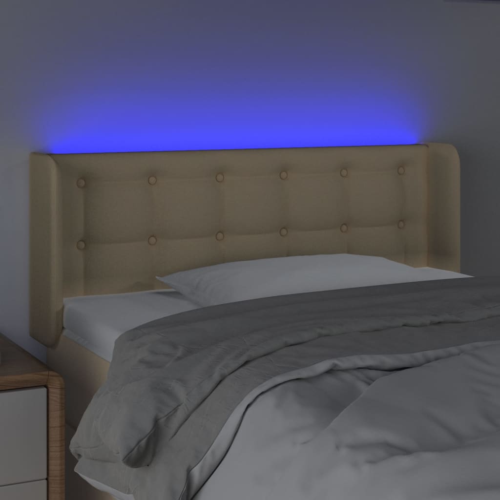 sengegavl med LED-lys 83x16x78/88 cm stof cremefarvet