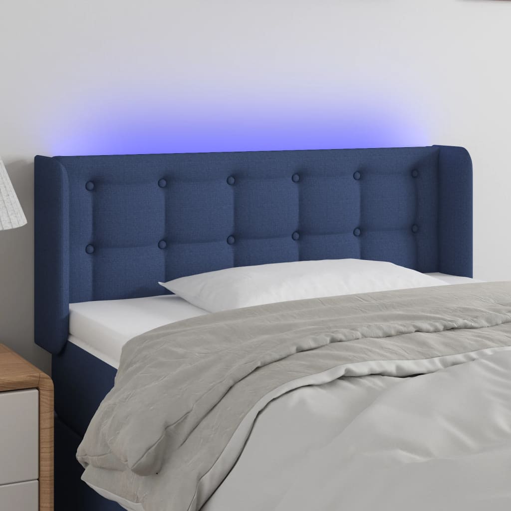 sengegavl med LED-lys 83x16x78/88 cm stof blå