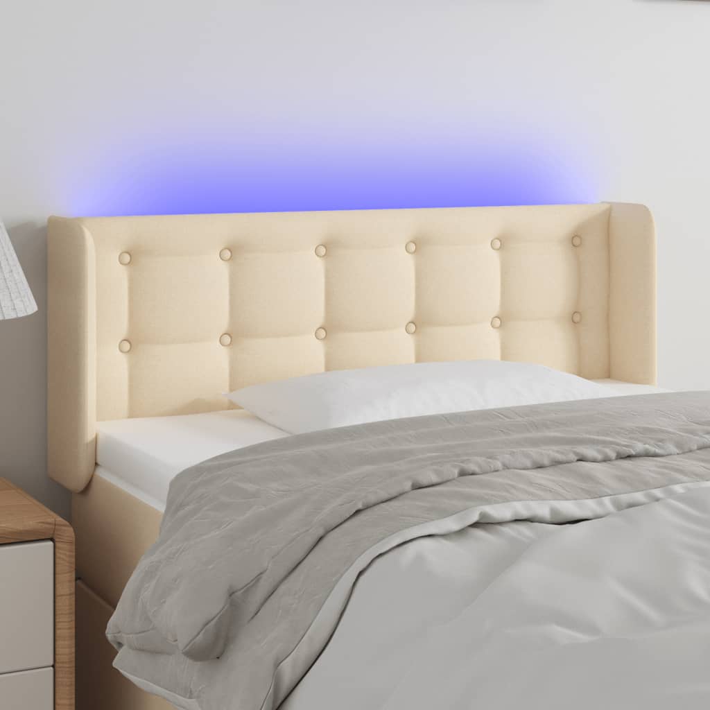 sengegavl med LED-lys 103x16x78/88 cm stof cremefarvet