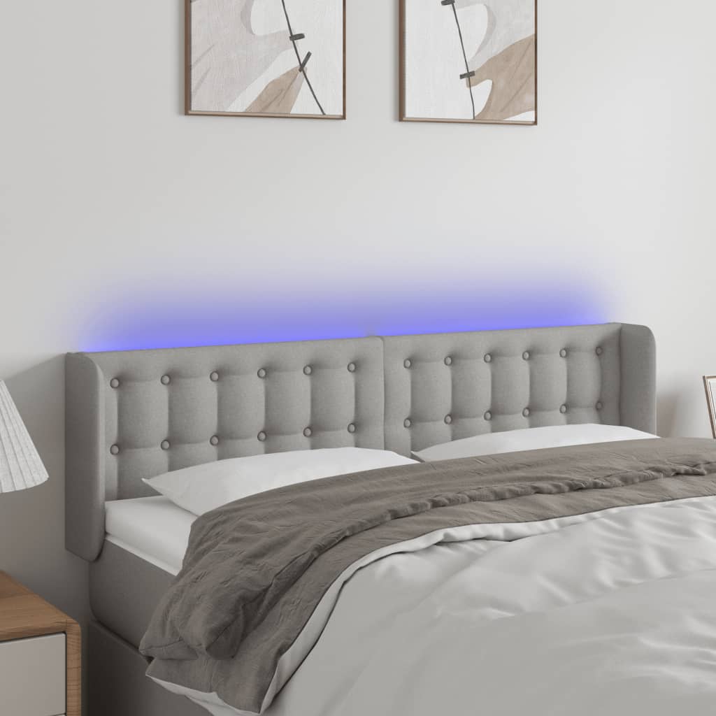 sengegavl med LED-lys 147x16x78/88 cm stof lysegrå