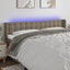 sengegavl med LED-lys 203x16x78/88 cm stof gråbrun