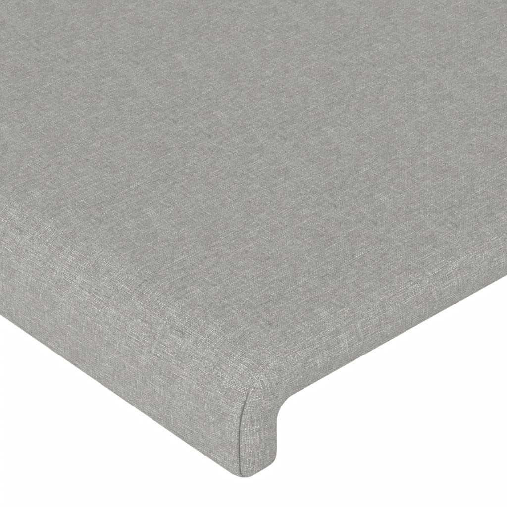 sengegavl med LED-lys 83x16x118/128 cm stof lysegrå