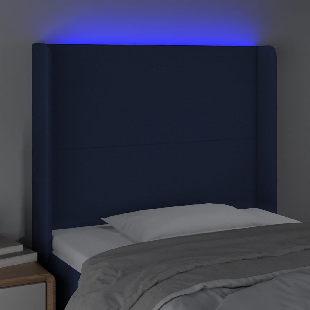sengegavl med LED-lys 83x16x118/128 cm stof blå