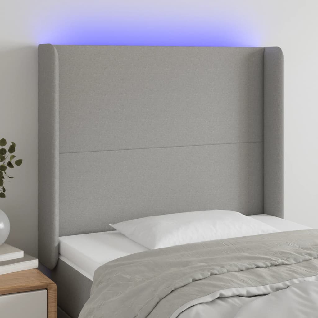sengegavl med LED-lys 103x16x118/128 cm stof lysegrå