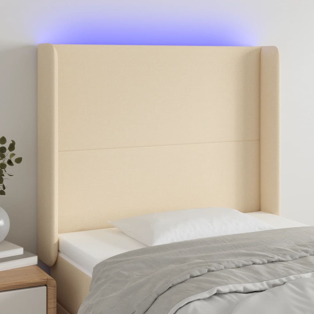 sengegavl med LED-lys 103x16x118/128 cm stof cremefarvet