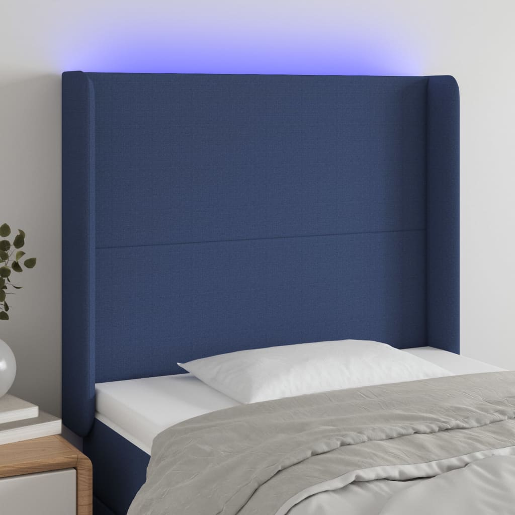 sengegavl med LED-lys 103x16x118/128 cm stof blå