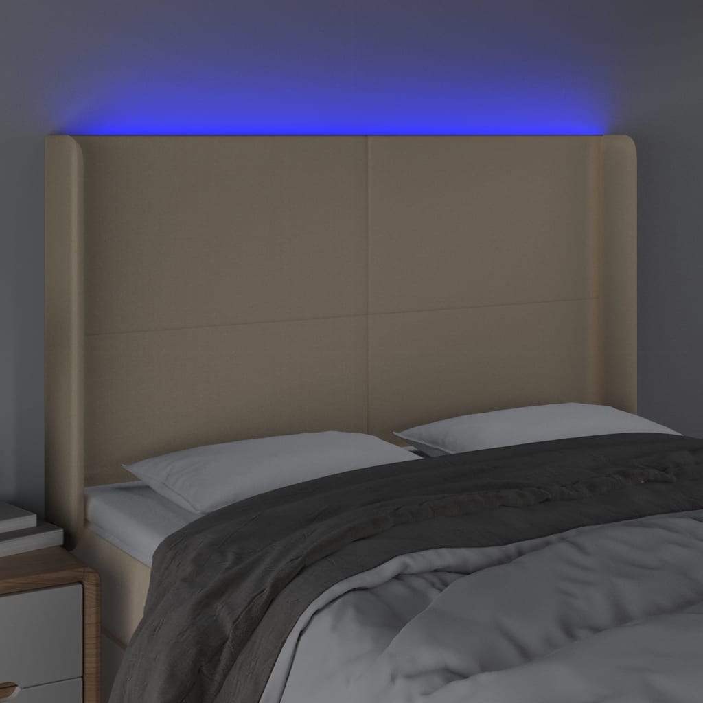 sengegavl med LED-lys 147x16x118/128 cm stof cremefarvet