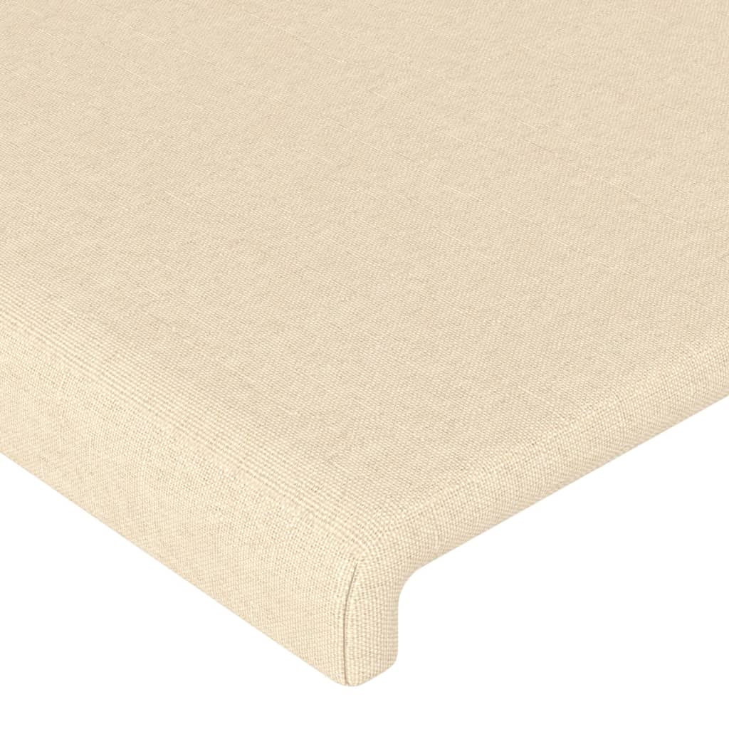 sengegavl med LED-lys 147x16x118/128 cm stof cremefarvet