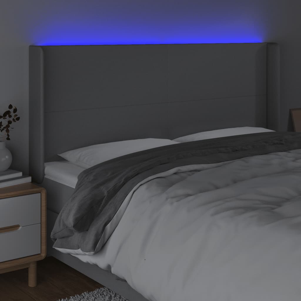 sengegavl med LED-lys 163x16x118/128 cm stof lysegrå