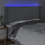 sengegavl med LED-lys 203x16x118/128 cm stof lysegrå