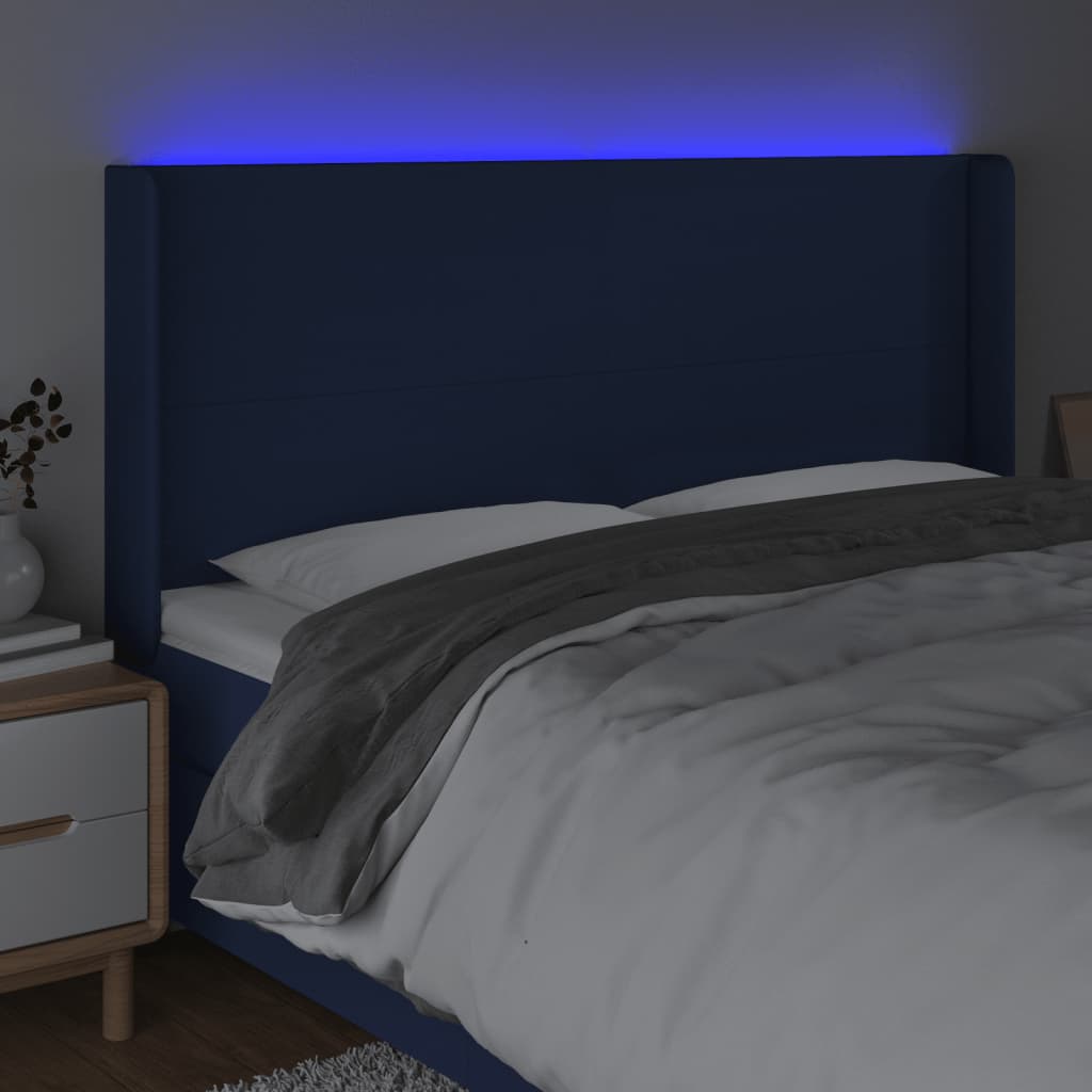 sengegavl med LED-lys 203x16x118/128 cm stof blå