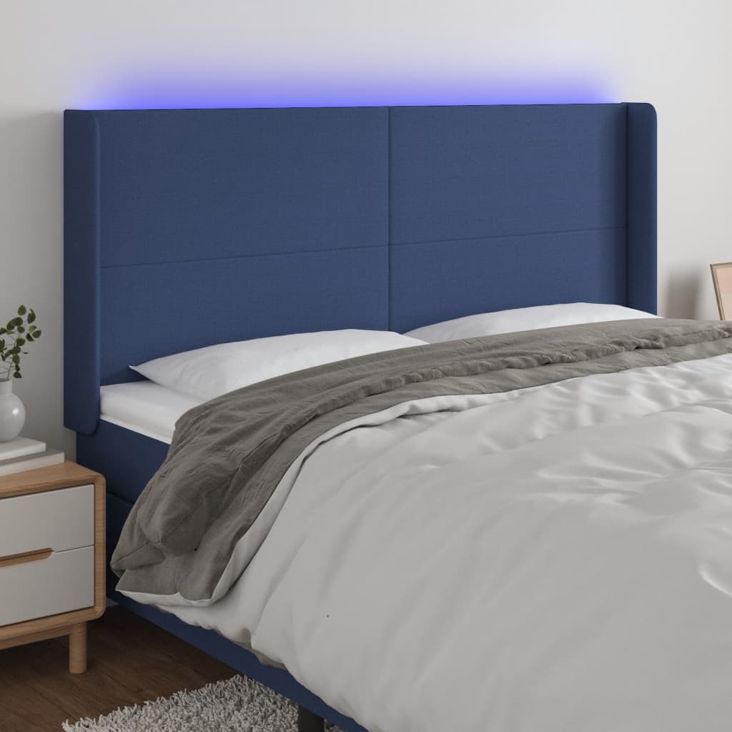 sengegavl med LED-lys 203x16x118/128 cm stof blå