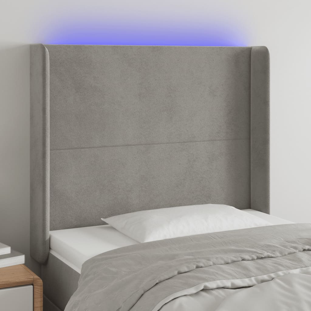 sengegavl med LED-lys 83x16x118/128 cm fløjl lysegrå