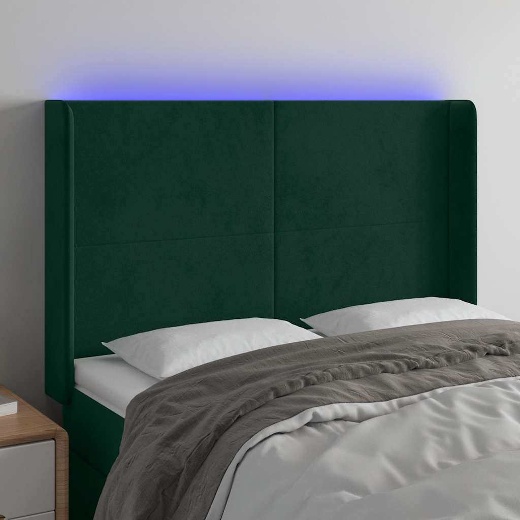 sengegavl med LED-lys 147x16x118/128 cm fløjl mørkegrøn