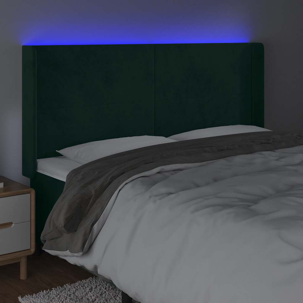 sengegavl med LED-lys 183x16x118/128 cm fløjl mørkegrøn