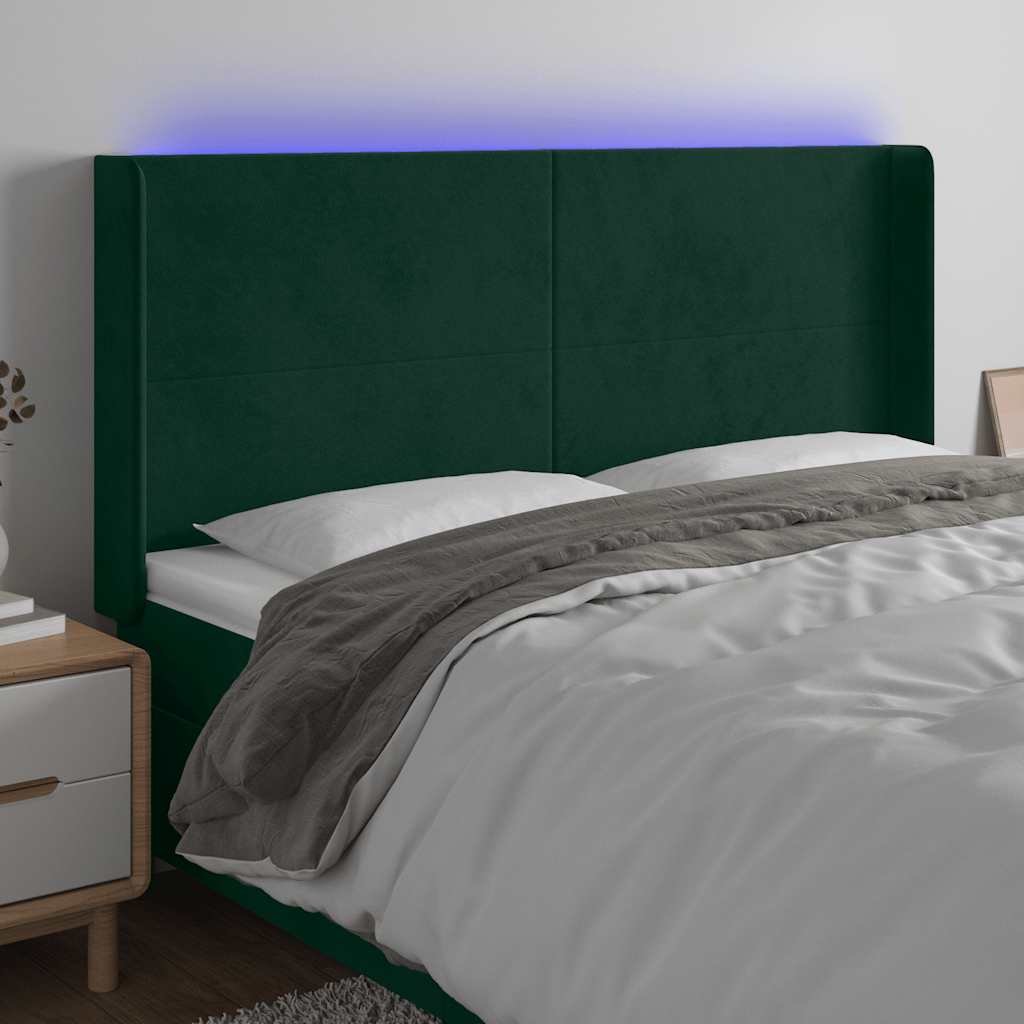 sengegavl med LED-lys 183x16x118/128 cm fløjl mørkegrøn