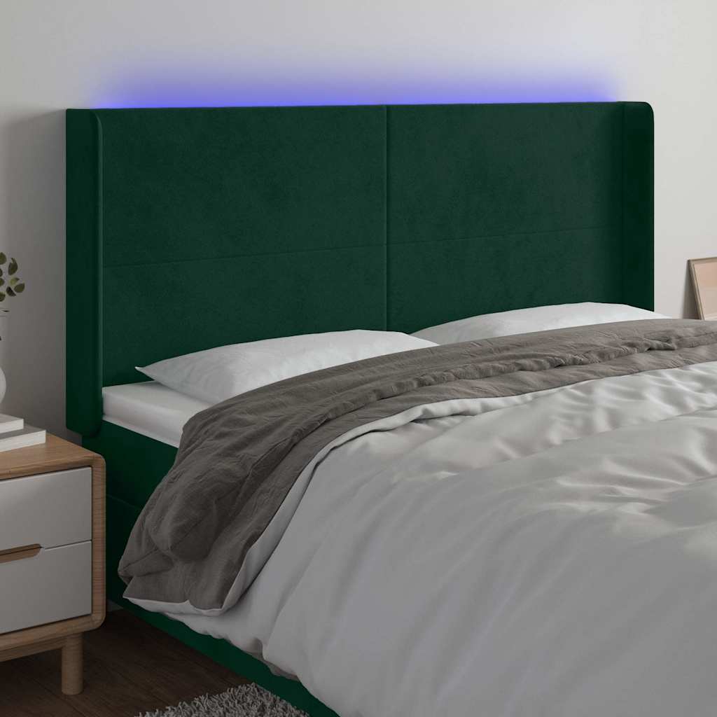 sengegavl med LED-lys 203x16x118/128 cm fløjl mørkegrøn