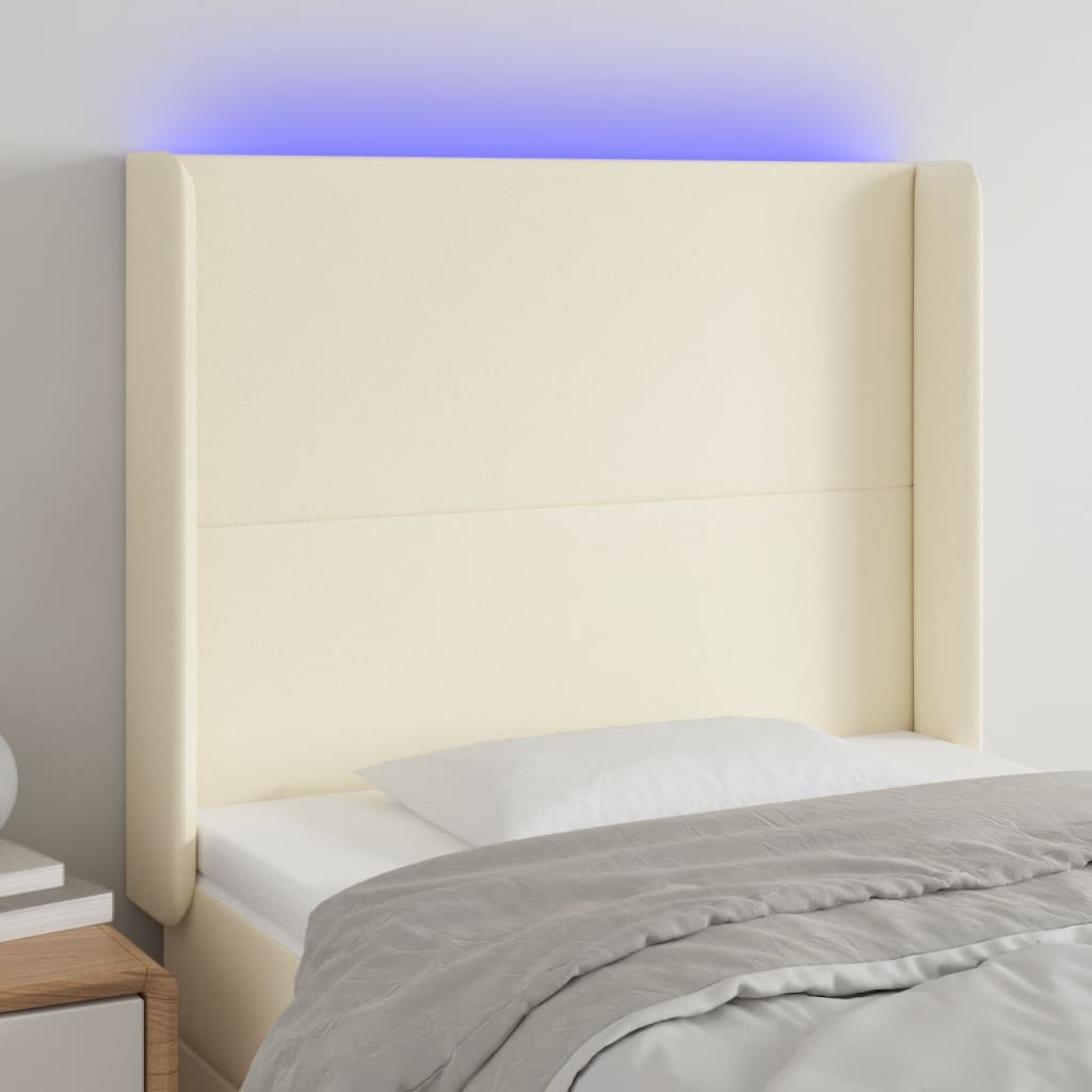sengegavl med LED-lys 83x16x118/128 cm kunstlæder cremefarvet