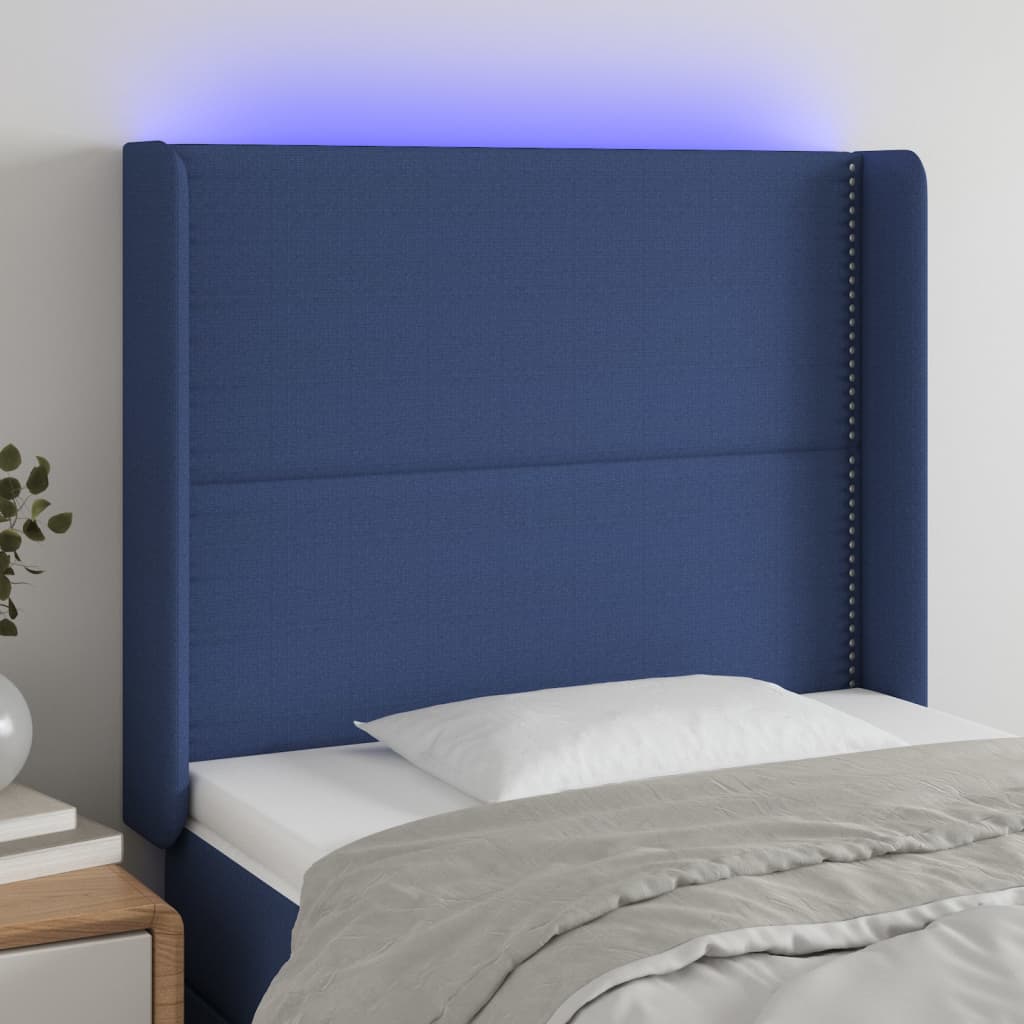 sengegavl med LED-lys 93x16x118/128 cm stof blå