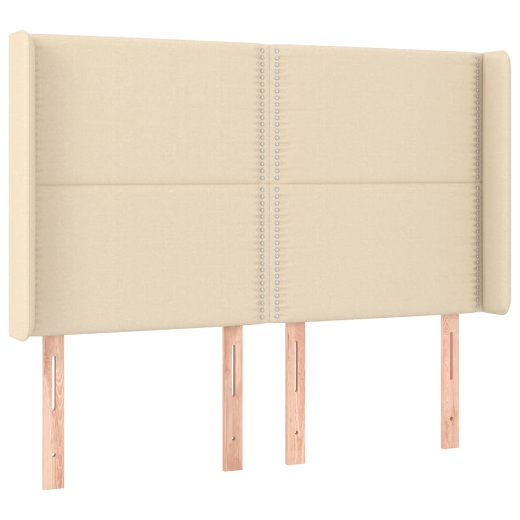 sengegavl med LED-lys 147x16x118/128 cm stof cremefarvet