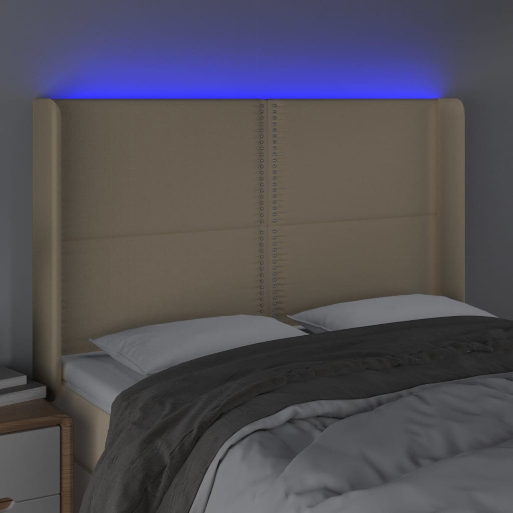 sengegavl med LED-lys 147x16x118/128 cm stof cremefarvet
