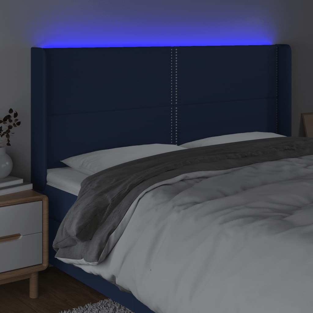 sengegavl med LED-lys 183x16x118/128 cm stof blå
