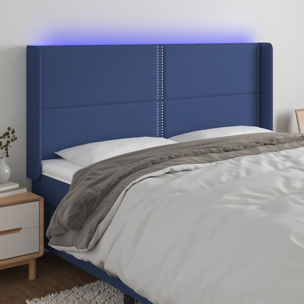 sengegavl med LED-lys 203x16x118/128 cm stof blå