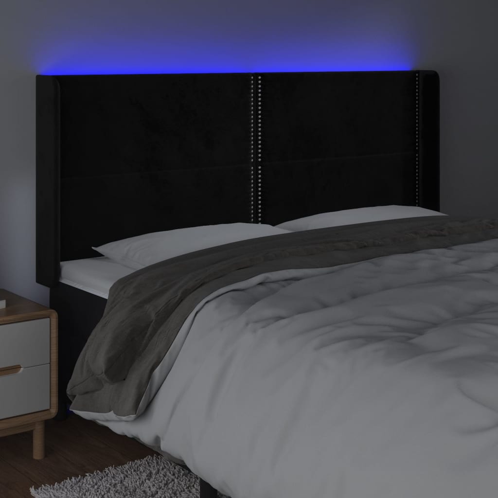 sengegavl med LED-lys 203x16x118/128 cm fløjl sort