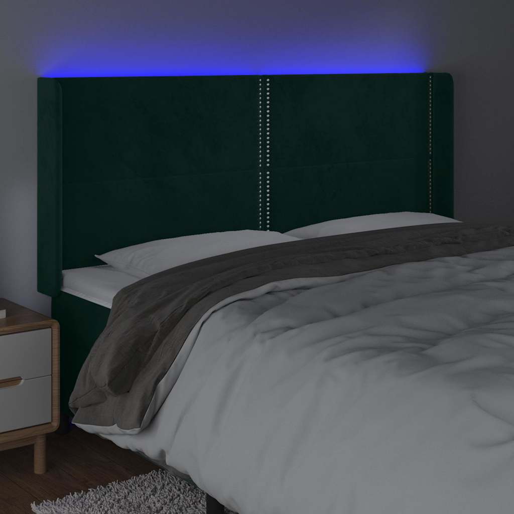 sengegavl med LED-lys 203x16x118/128 cm fløjl mørkegrøn