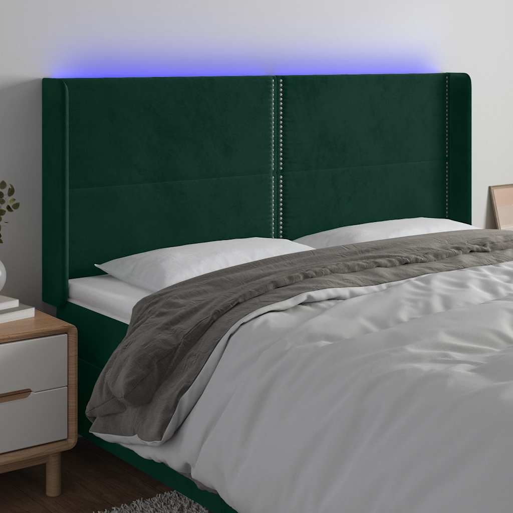 sengegavl med LED-lys 203x16x118/128 cm fløjl mørkegrøn