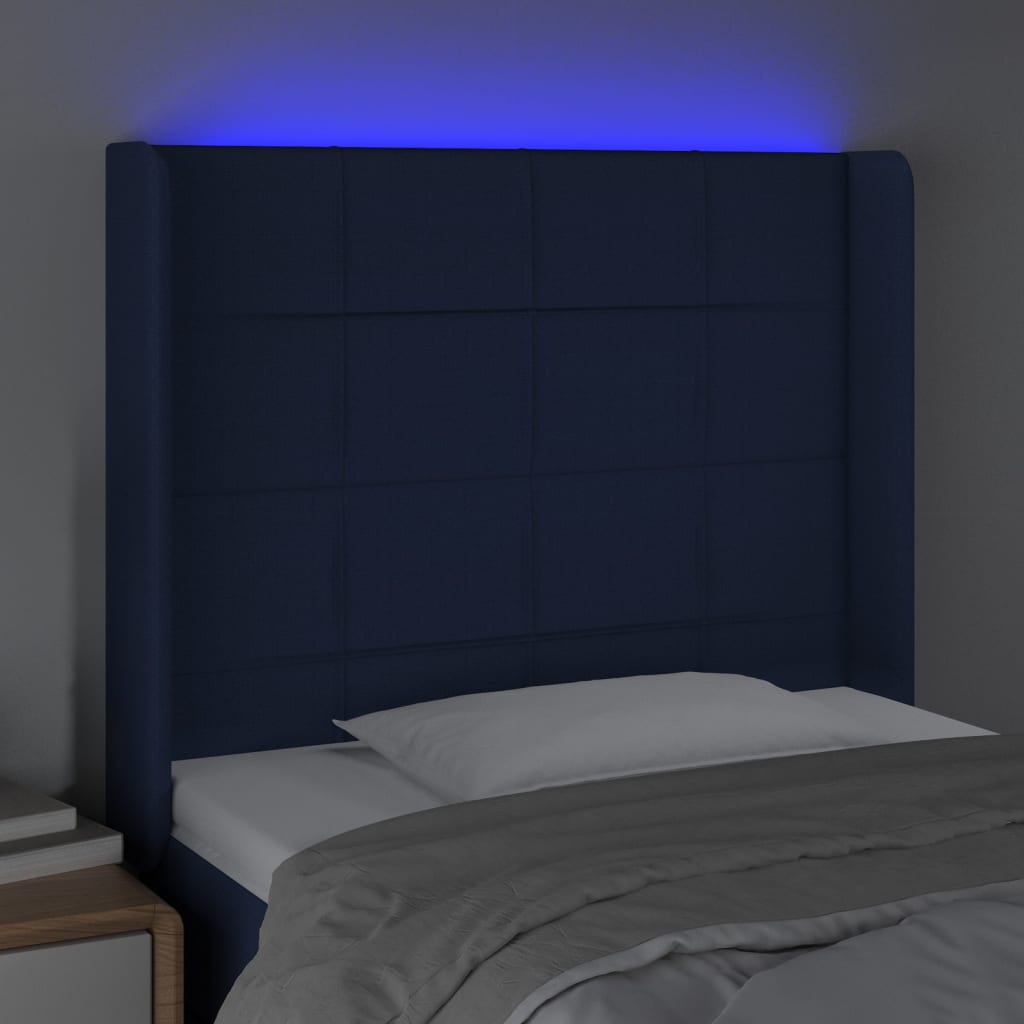sengegavl med LED-lys 83x16x118/128 cm stof blå