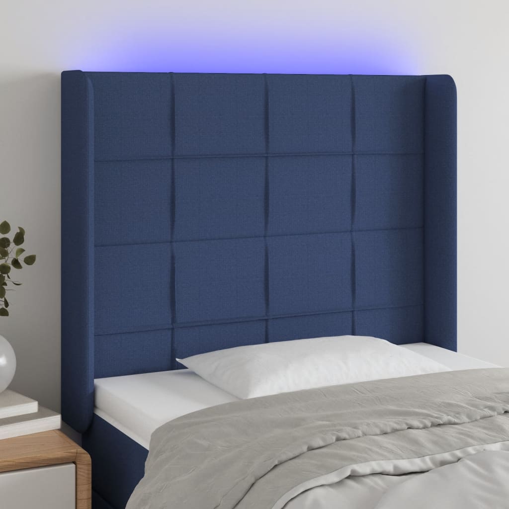 sengegavl med LED-lys 93x16x118/128 cm stof blå