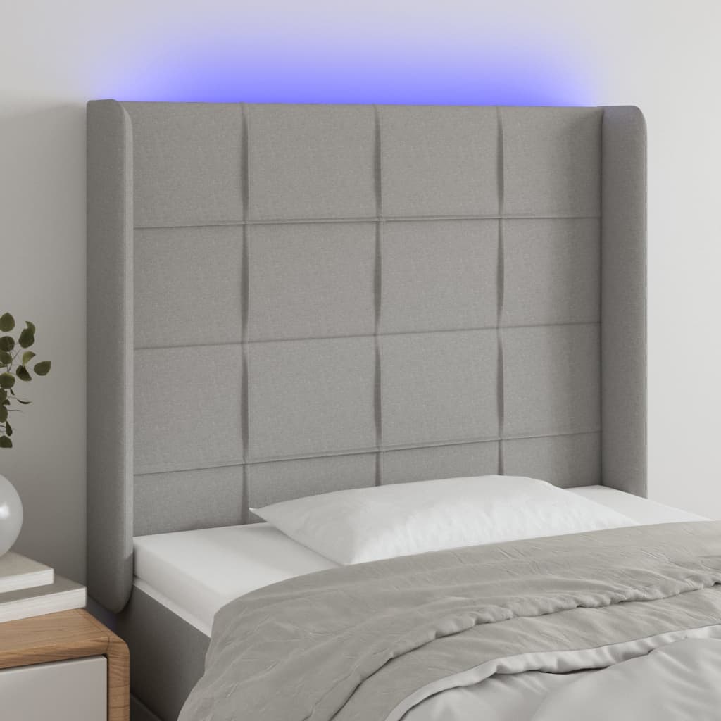 sengegavl med LED-lys 103x16x118/128 cm stof lysegrå