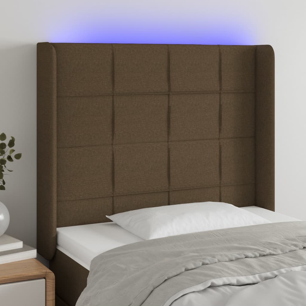 sengegavl med LED-lys 103x16x118/128 cm stof mørkebrun