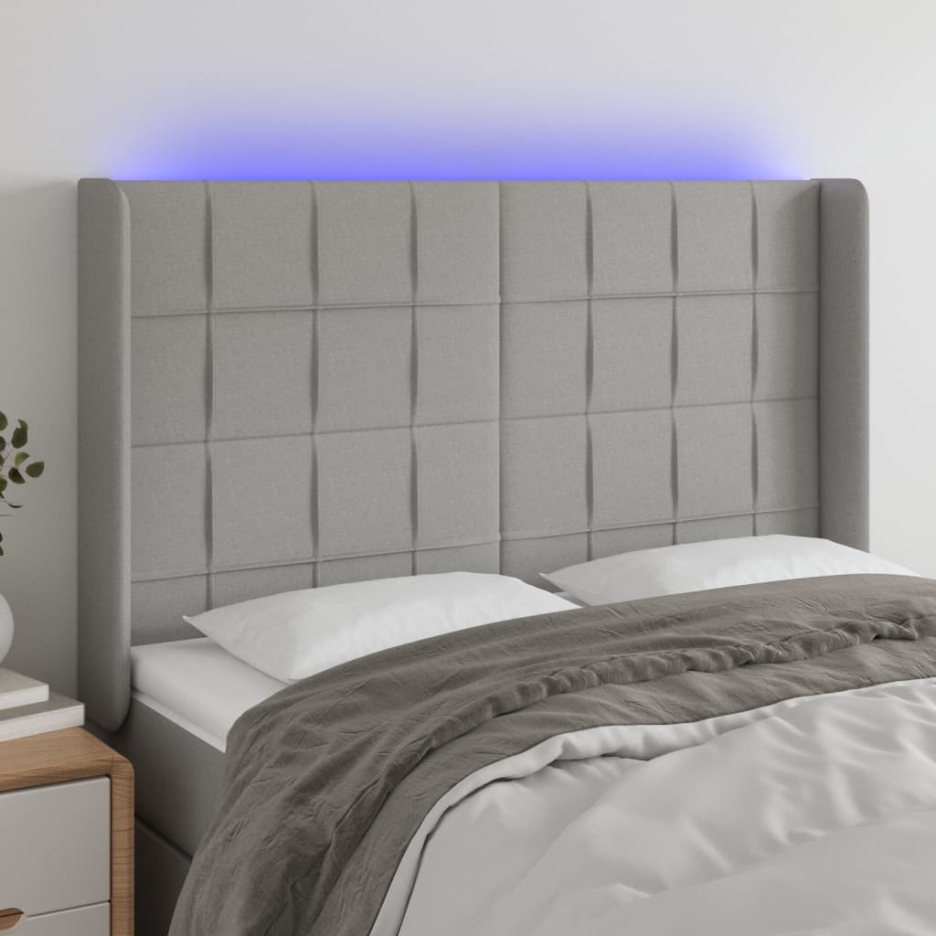 sengegavl med LED-lys 147x16x118/128 cm stof lysegrå